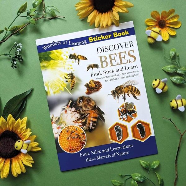Discover Bees sticker activity book displayed with sunflowers and bee decorations