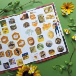 Open Discover Bees book showing colourful bee stickers and activities