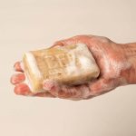 Bee Cosmetics honey and oatmeal soap being used to wash hands
