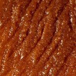 Close-up of the rich, grainy texture of Bee Cosmetics honey sugar face scrub