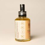 Front view of the Bee Cosmetics jojoba cleansing oil pump bottle