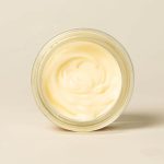 Open jar of Bee Cosmetics rejuvenating facial cream viewed from above