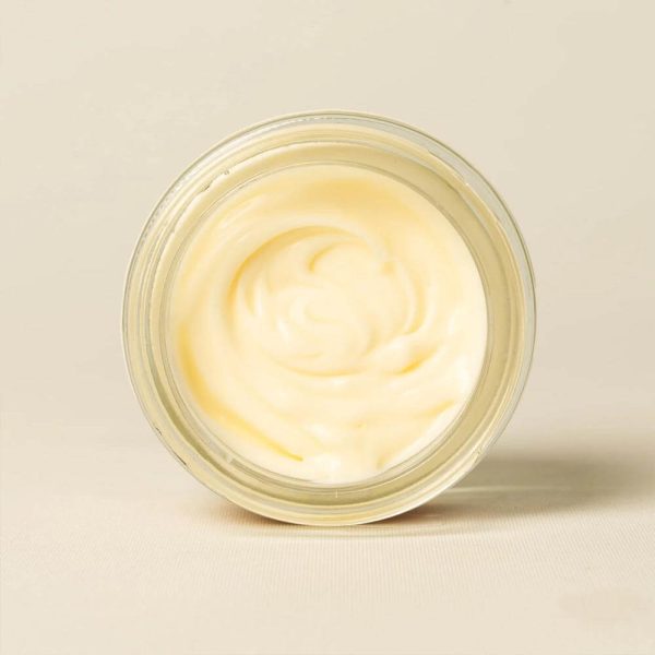 Open jar of Bee Cosmetics rejuvenating facial cream viewed from above